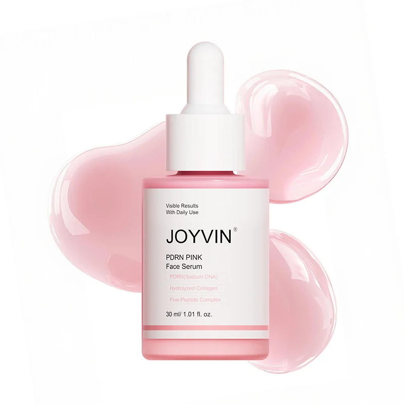 JOYVINN Pink Glow Serum mit Lachs-PDRN, 30 ml Pipettenflasche vor rosa Serum-Tropfen
